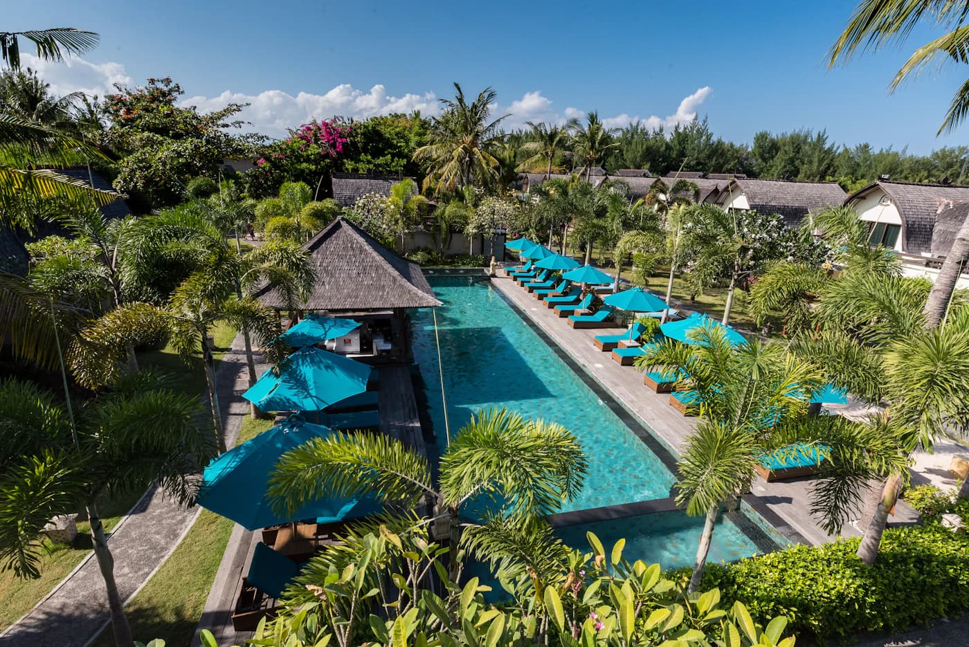 Aerial view of the long pool and resort gardens