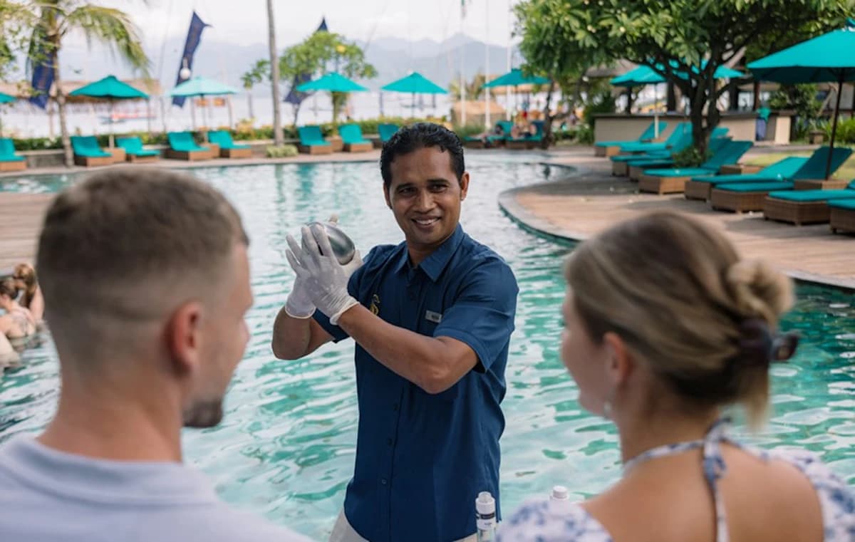 A bartender mixing tropical cocktails
