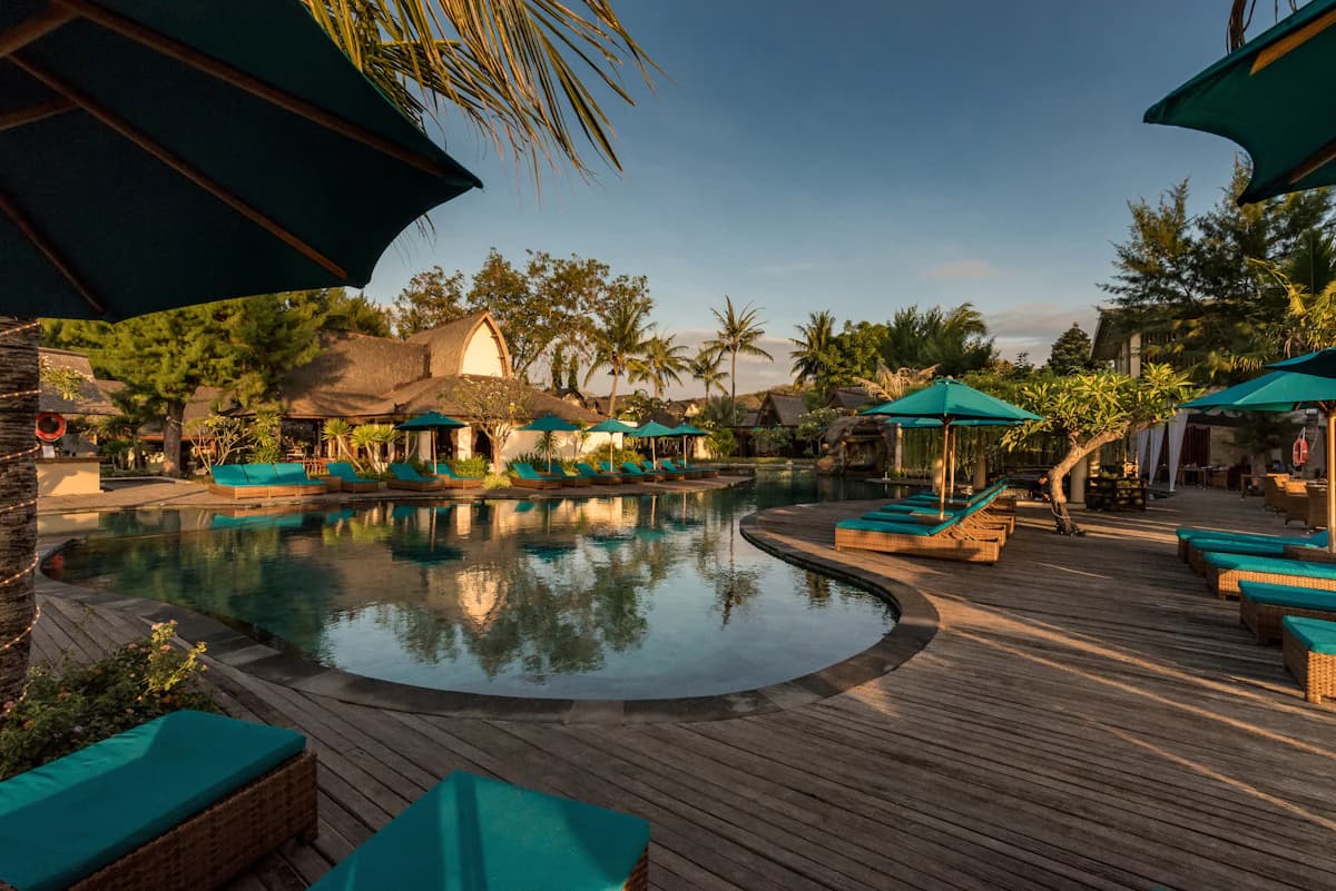 Vila Ombak's beachfront pool at golden hour