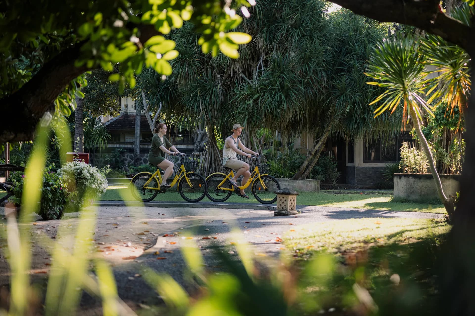 Guests cycling leisurely around the resort grounds